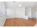 Spacious living room with wood floors, neutral paint, and large windows providing ample natural light at 1524 Remembrance Hill St, Las Vegas, NV 89144
