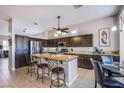 Kitchen with granite countertops, stainless steel appliances, and a center island with barstool seating at 1552 Livingston Dr, Henderson, NV 89012