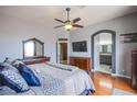 Spacious main bedroom featuring hardwood floors, neutral walls, and a ceiling fan at 1552 Livingston Dr, Henderson, NV 89012
