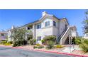 Charming condo building showcasing well-kept grounds with mature landscaping and inviting curb appeal at 2117 Echo Bay St # 102, Las Vegas, NV 89128