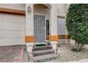 Close-up of a charming front entrance with a secure gate and a welcoming 'WELCOME' sign at 2130 Trebbiano Way, Las Vegas, NV 89156