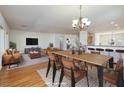 The dining room flows from the living area and features hardwood floors and a chandelier at 2219 Sawtooth Mountain Dr, Henderson, NV 89044