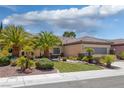 Beautiful single-story house with desert landscaping, a tile roof, and a well-maintained front yard at 2295 Otter Rock Ave, Henderson, NV 89044