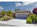 Attractive single-Gathering home with a two-car garage, manicured landscaping, and a tile roof at 2295 Otter Rock Ave, Henderson, NV 89044
