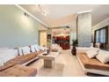Bright and spacious living room with decorative pillar, tile flooring, and comfortable seating at 2455 W Serene Ave # 923, Las Vegas, NV 89123