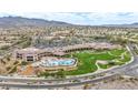 An expansive aerial view showcasing the pool, the community center, and the surrounding neighborhood at 2571 Thatcher Ave, Henderson, NV 89052