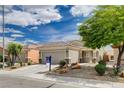 Well-maintained single-story home with desert landscaping and a two-car garage at 2621 Ground Robin Dr, North Las Vegas, NV 89084