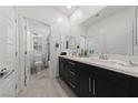 Bathroom features a double vanity with a large mirror and a separate toilet room for added privacy at 31 Strada Loreto, Henderson, NV 89011