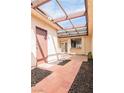 Private courtyard with a beautiful lattice covering, creating the perfect outdoor retreat at 3140 Pradera Cir, Las Vegas, NV 89121