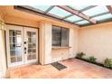 Inviting patio with tiled floor, a lattice overhead and seamless indoor-outdoor living at 3140 Pradera Cir, Las Vegas, NV 89121