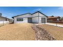 This newly renovated home boasts an updated exterior with modern design and low-maintenance desert landscaping at 3330 Rio Grande St, Las Vegas, NV 89115