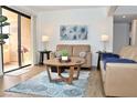 Cozy living room featuring a sliding glass door to the patio and comfortable seating at 3740 Desert Marina Dr # 11, Laughlin, NV 89029