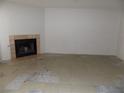 Spacious living room featuring a cozy fireplace and tile flooring, perfect for relaxation at 3890 Terrazzo Ave, Las Vegas, NV 89115