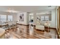 Spacious living room with hardwood floors, neutral furniture, and abundant natural light flowing into the space at 4135 Pistachio Nut Ave, Las Vegas, NV 89115