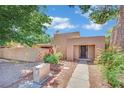Charming single-story home with stucco exterior, desert landscaping and inviting front entryway at 4237 Brockton Green Ct, Las Vegas, NV 89110