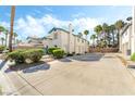 Charming townhouse with well-maintained landscaping, private driveways and a two car garage at 5025 Starfinder Ave, Las Vegas, NV 89108