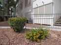 Close up of well-kept landscaping with gravel and colorful bushes at 5241 Caspian Springs Dr # 103, Las Vegas, NV 89120