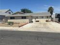 Charming single-story home with a spacious driveway and a low-maintenance front yard at 5424 Del Rey Ave, Las Vegas, NV 89146