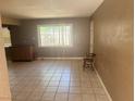 Inviting living room with tiled floors, a neutral palette, and ample natural light at 5424 Del Rey Ave, Las Vegas, NV 89146
