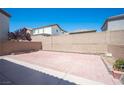 Spacious backyard featuring a large brick-paved area, perfect for outdoor activities and entertaining at 5638 Jelsma Ave, Las Vegas, NV 89141