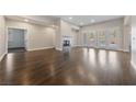 Spacious living room featuring wood floors and a cozy fireplace at 616 Canyon Brook Pl, Las Vegas, NV 89145