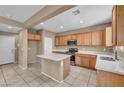 Bright kitchen with stainless steel appliances, an island, and ample cabinet space at 637 Our Heritage St, Henderson, NV 89011