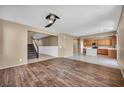 Spacious living room featuring hardwood floors, a ceiling fan, and an open concept at 637 Our Heritage St, Henderson, NV 89011