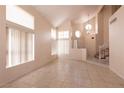 Bright living room with neutral tones and tiled floors at 7620 Tortola Bay Ln, Las Vegas, NV 89128