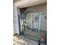 Enclosed front entrance features a wrought-iron gate for added security and charm at 9641 Windborne Ave, Las Vegas, NV 89147