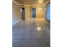 Spacious living room featuring tile floors and ample natural light at 1020 Wengert Ave, Las Vegas, NV 89104
