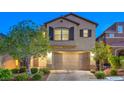 Charming two-story home with a well-manicured lawn and a two-car garage at 10425 White Princess Ave, Las Vegas, NV 89166