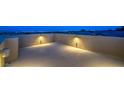 Spacious rooftop patio with stylish lighting and stunning city views at twilight at 10425 White Princess Ave, Las Vegas, NV 89166