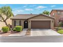 Charming single-story home with a well-maintained yard and a two-car garage at 10741 Pearl River Ave, Las Vegas, NV 89166