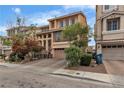 Attractive multi-story home with a well-maintained lawn, inviting curb appeal, and a private driveway at 1161 Sax Fifth Ave, Henderson, NV 89052
