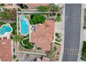 Aerial view of a home with a pool, spa, patio, tile roof, and a landscaped backyard at 150 Wentworth Dr, Henderson, NV 89074