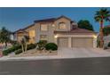 Inviting two-story home with desert landscaping, a two-car garage, and well-maintained grounds at 150 Wentworth Dr, Henderson, NV 89074
