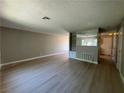 Inviting living room features laminate flooring and neutral paint, creating a bright atmosphere at 173 Greenbriar Townhouse Way, Las Vegas, NV 89121