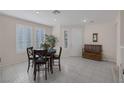Bright dining area with tile floors, ample natural light, and neutral decor at 1912 Summer Pine Ct # 103, Las Vegas, NV 89134