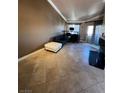 Inviting living room featuring tile floors, a comfortable couch and neutral colors at 210 E Flamingo Rd # 419, Las Vegas, NV 89169