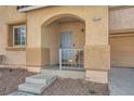 Close-up of front porch with archway and well-maintained desert landscaping at 2714 Cottonwillow St, Las Vegas, NV 89135