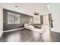 Open-concept living room with modern floors and large windows at 2714 Cottonwillow St, Las Vegas, NV 89135