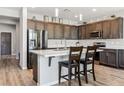 Beautiful kitchen with a large island, stainless steel appliances, and dark wood cabinets at 3096 Cipro Ave, Las Vegas, NV 89141