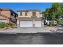 Two-story home with a three-car garage, desert landscaping, and mature shade tree at 3794 Cape Royal St, Las Vegas, NV 89147