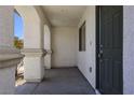 Inviting covered entryway featuring sturdy support pillars and a secure front door at 3961 Bayamon St, Las Vegas, NV 89129