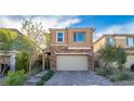 Charming home featuring a brick-accented facade and well-maintained landscaping at 397 Purple Sandpiper St, Las Vegas, NV 89138