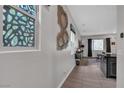 Bright, stylish entry featuring decorative art and a glimpse into the spacious living area at 397 Purple Sandpiper St, Las Vegas, NV 89138