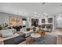 Open-concept living space with modern decor, connected to the dining and kitchen areas at 397 Purple Sandpiper St, Las Vegas, NV 89138