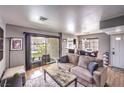 Cozy living room with a sliding glass door and comfortable seating, perfect for relaxation at 4809 S Torrey Pines Dr # 201, Las Vegas, NV 89103
