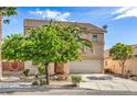 Inviting two-story house with lush landscaping, a well-manicured lawn, and a convenient two-car garage at 5005 Justice Creek Ave, Las Vegas, NV 89131
