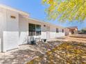 Front of a well-maintained single-story home with covered entryway and desert landscaping at 525 Engel Ave, Henderson, NV 89011